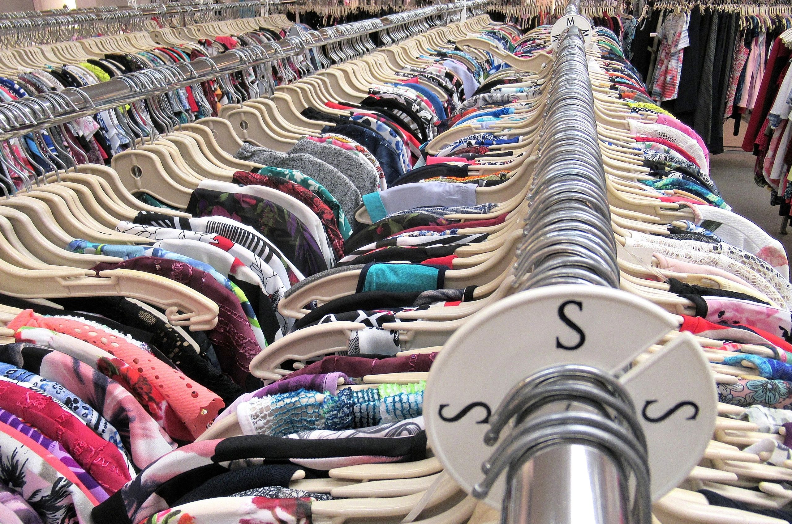 Rows of clothing hanging on racks