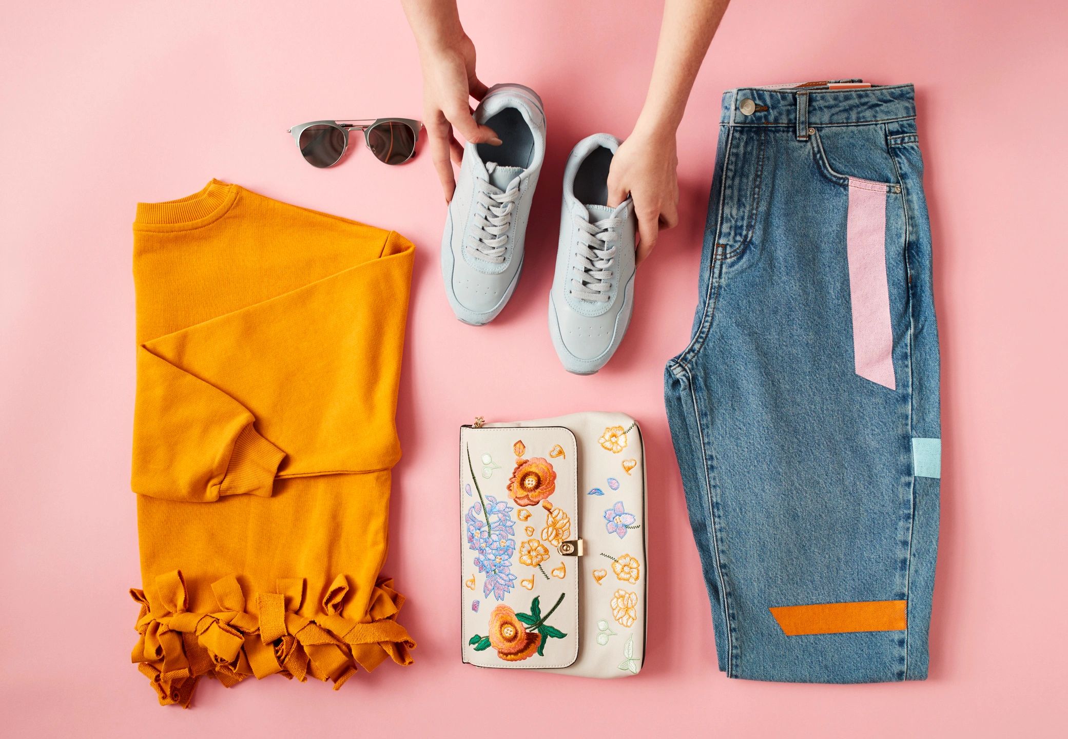 Flat lay of children's clothing arranged neatly